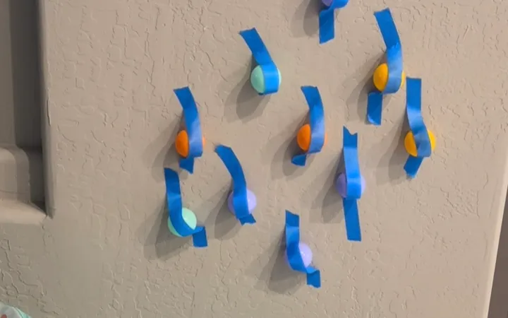 Plastic Balls Taped to a Wall: A 5-Minute Toddler Activity (Ages 2-4)