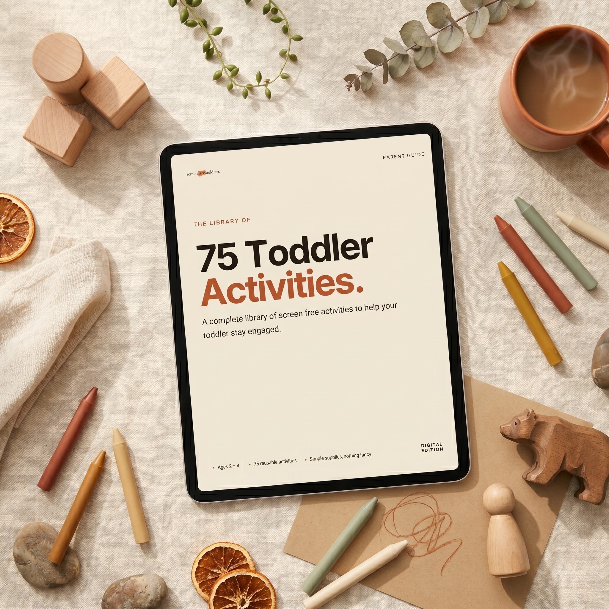 The 75 Activities Guide PDF open on a phone, held in one hand on a kitchen counter